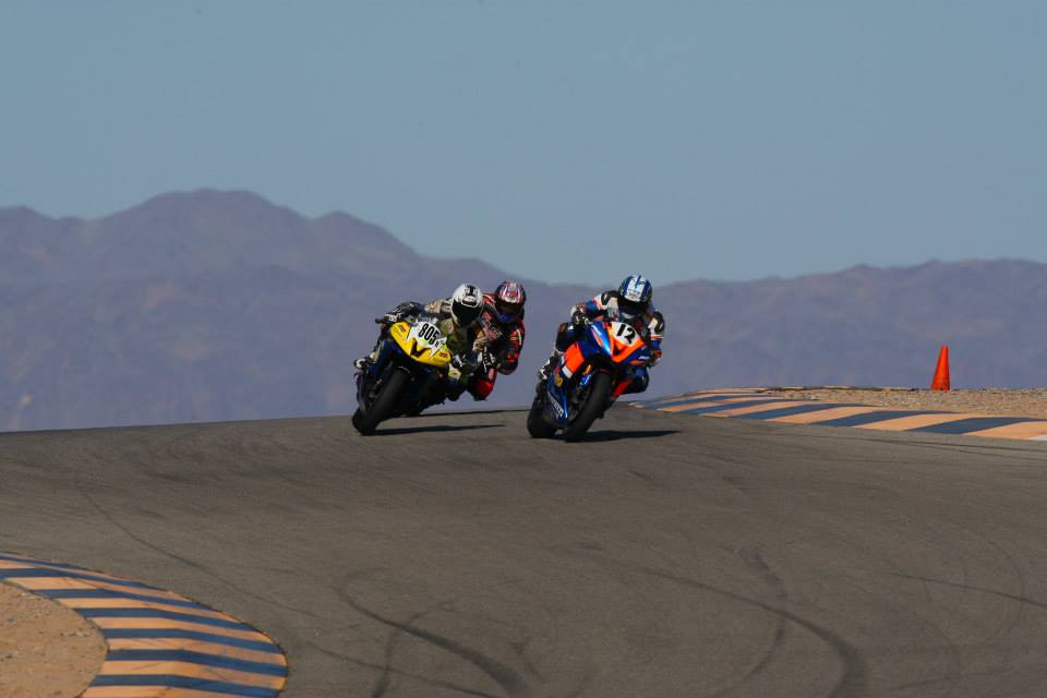 Brian Short number 12 in close competition through a fast corner at the racetrack