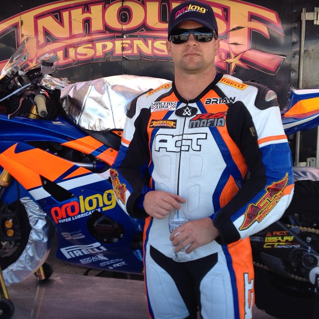 Brian Short in racing leathers in the paddock at Chuckwalla Valley Raceway